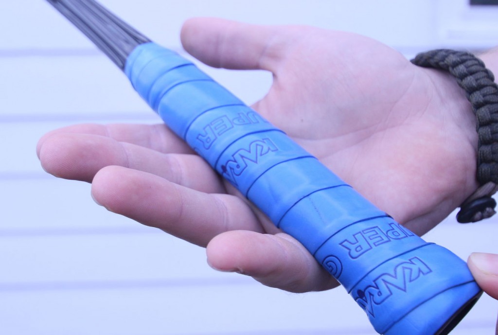 lay the squash racket over the palm of your hand