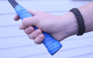 the way to grip a squash racket is often described as like shaking a hand